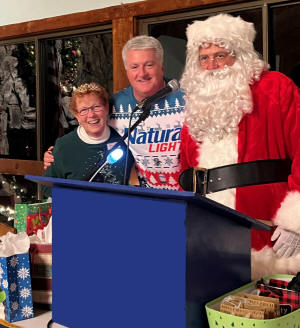 Matriarch Debra receives a tiara from Santa and Commander Barnhill.