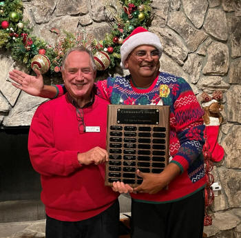 KT receives the 2022 Commander's Award from P/C Urquhart.